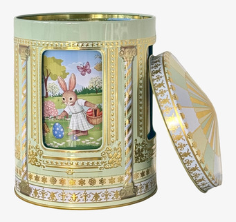 Bild av påsktema plåtburk med speldosa och kaninmotiv