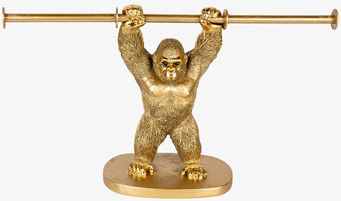 Bild på gyllene gorillaformad pappershållare i detalj