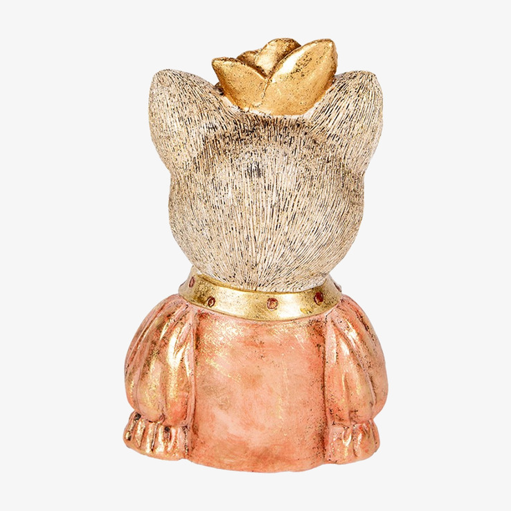 Bild av dekorativ kattstaty med guldfärgade detaljer