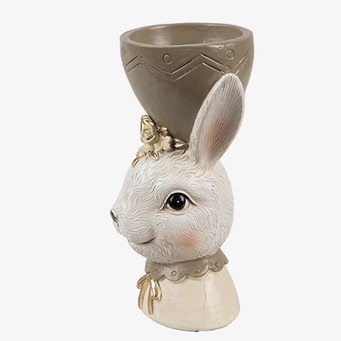 Bild av charmig äggkopp med kaninmotiv och gulddetaljer