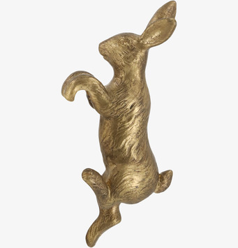 Bild av dekorativ klättrande kanin i mässing