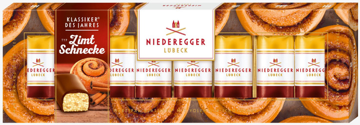 Bild av stilfull presentförpackning med marsipan kanelbullar