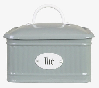 Bild av grön plåtburk med retrodesign och porslinsdetaljer