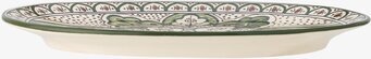 Bild av ett serveringsfat med grönt och krämigt mönster