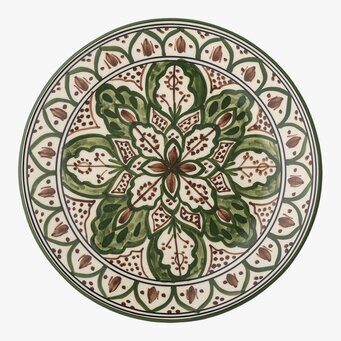 Bild av grön assiett med blommönster och hantverkskänsla