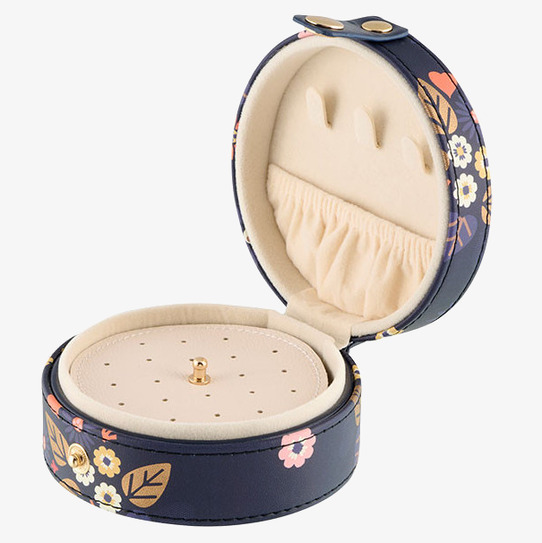 Bild av ett runt, blommigt och dekorativt smyckesskrin