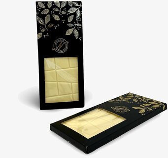 Bild av elegant vit choklad i stilfull förpackning