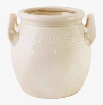 Bild på krämvitt keramikkrus med handtag och diskret mönster