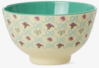 Bild på liten skål med blommigt mönster och turkos insida