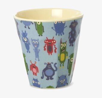 Bild på färgglad mugg med monster – lekfull design för köket