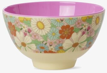 Bild av liten skål med färgglatt blommönster och lila insida