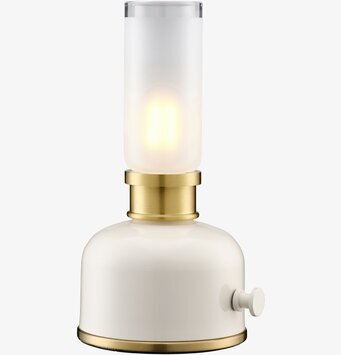 Bild på stilren bordslampa i beige, mässing och glas