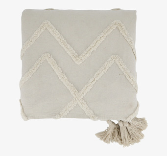 Bild av sängöverkast i offwhite med broderi och tofsar