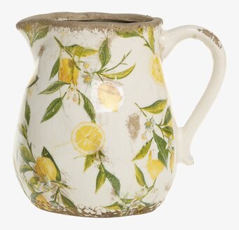 Bild av kanna med citronmotiv och patina i lantlig stil