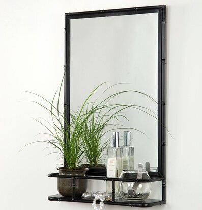 Bild: Stilren spegelhylla i svart metall med dekorativa detaljer