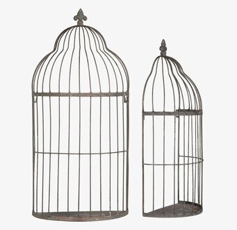 Bild på två dekorativa metallburar för vägg eller hylla hemma