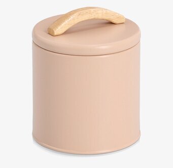 Bild på stilren beige förvaringsburk med trähandtag i kök