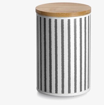 Bild på stilren plåtburk med trälock och grafiska ränder