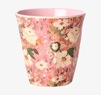 Bild på färgglad mugg med blommönster och rosatonad insida