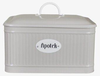 Bild på beige plåtburk med oval skylt och handtag på locket