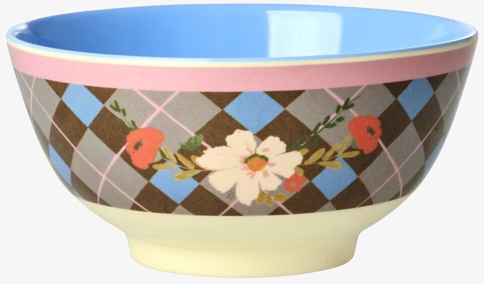 Bild på färgstark skål med rutmönster och blommotiv
