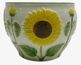 Bild av glaserad kruka med solrosmotiv och rundad form