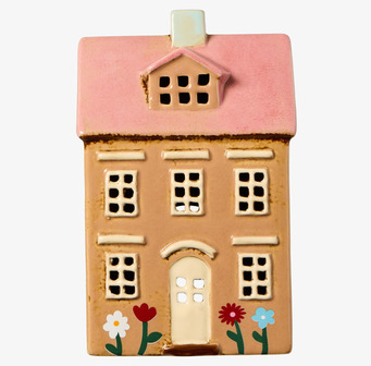 Bild av keramikljuslykta med pastellrosa tak och blommor