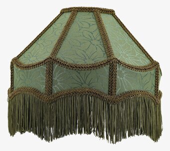 Bild på grön lampskärm med frans och växtmönster i tyg