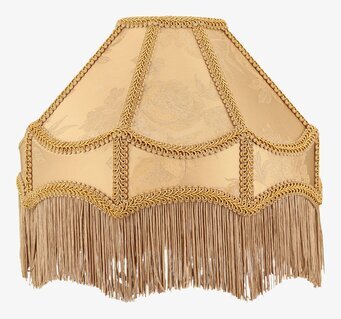 Bild av gyllene lampskärm med fransar och blommönster