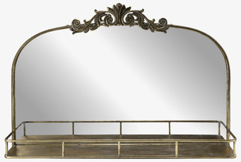 Bild på väggspegel med hylla i antik mässing och bladdekor