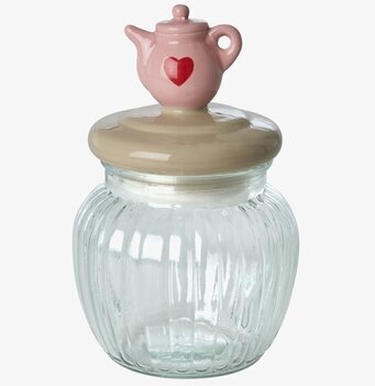 Bild av glasburk med keramiklock och tekanna som handtag