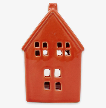 Bild på dekorativ ljuslykta som stiliserat rostrött hus