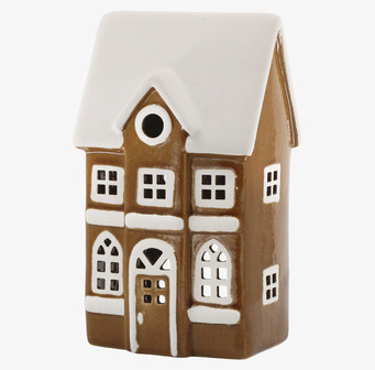 Bild av ljuslykta i form av snötäckt keramikhus med värmeljus