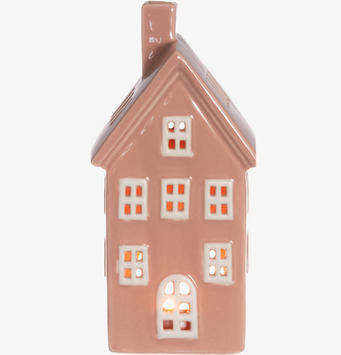 Bild av rosa keramikljuslykta i form av hus med vitt tak