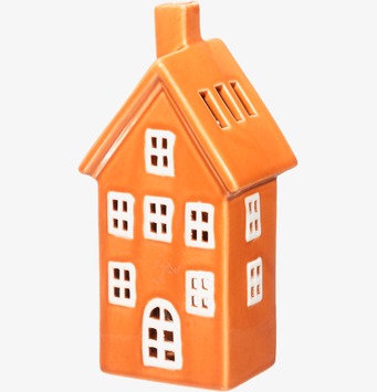 Bild av orange ljuslykta i form av keramik hus med fönster