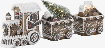 Bild: Juldekoration med pepparkakståg, bakverk och ljusslinga