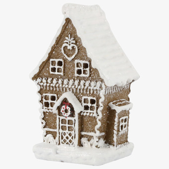 Bild på charmigt pepparkakshus med LED-belysning och vinterkänsla