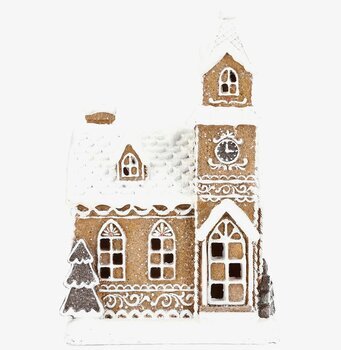 Bild av vintrigt pepparkakshus med kristyr och snödetaljer