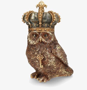 Bild av dekorativ uggla med krona och nyckel i brons och guld