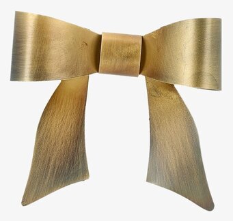 Bild på gyllene väggdekoration i form av rosett i metall