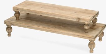 Bild på ljusbrunt piedestalbord i trä med två hyllplan