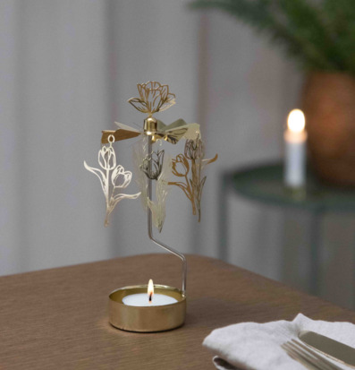 Bild på värmeljusdrivet änglaspel med tulpaner och blad