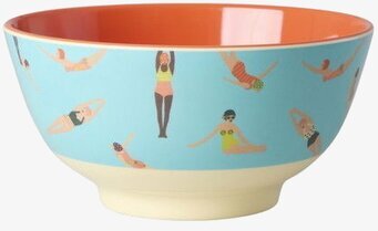 Foto: Turkos skål med orange insida och simmönster