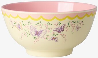 Foto: Skål med fjärilar, blommor och rosa insida