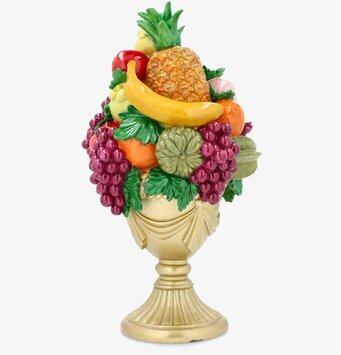 Foto fruktkorg på fot med ananas, banan och druvor