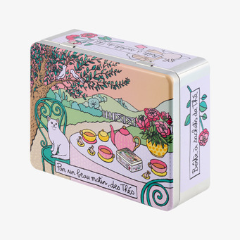 Foto: Illustrerad plåtburk för te med katt och blommor