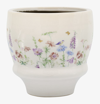 Foto: Benvit kruka med blomster, fjärilar och fågelmotiv