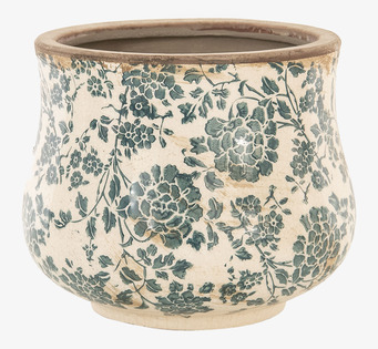 Foto: Beige kruka med grönt blommönster på vit bakgrund