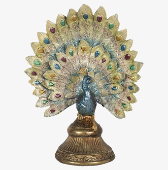 Foto: Påfågel figur med färgade stenar och guldfot