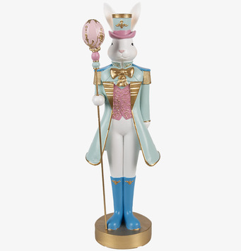 Bild på kaninfigur i turkos uniform med guldstav